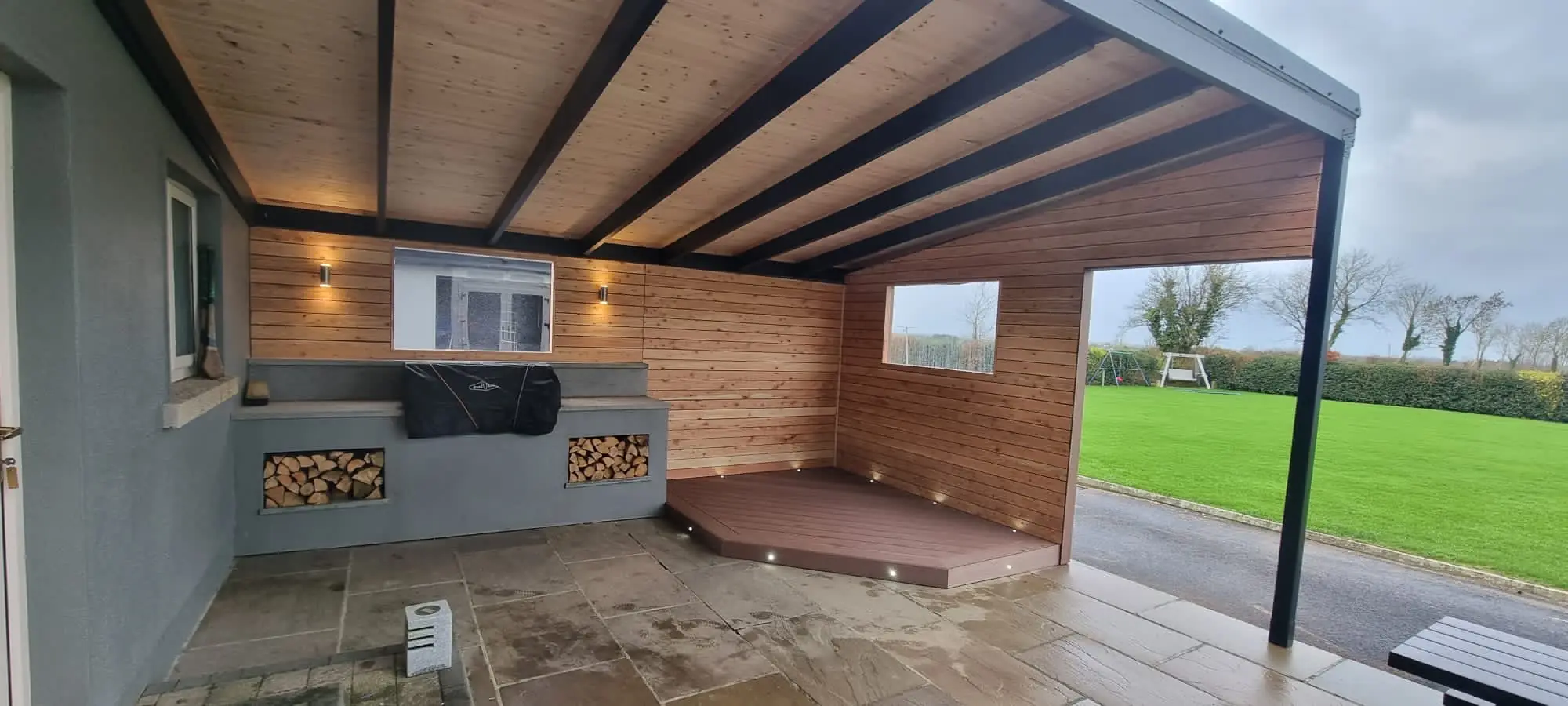 Covered outdoor living space on Fortress steel framing with larch cladding, Offaly